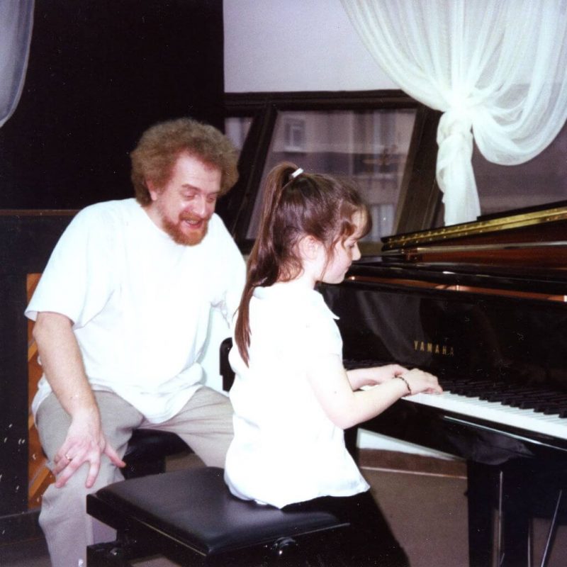 Alex Sokol with a piano student